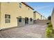Spacious backyard featuring a brick paver patio, mature shrubs and privacy wall, ideal for outdoor entertaining and relaxation at 4641 Therapeutic St, North Las Vegas, NV 89031