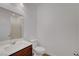 Clean bathroom with single vanity, mirror, toilet, and tile flooring at 4641 Therapeutic St, North Las Vegas, NV 89031