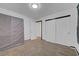 Comfortable carpeted bedroom with closet and neutral walls with black trim at 4641 Therapeutic St, North Las Vegas, NV 89031