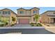 Beautiful two-story home with a well-manicured front yard and attached two-car garage at 4641 Therapeutic St, North Las Vegas, NV 89031