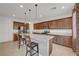 Kitchen featuring granite counters, stainless appliances, and dark wood cabinetry at 4641 Therapeutic St, North Las Vegas, NV 89031