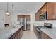 Kitchen with granite countertops, a stainless steel refrigerator, and gas range at 4641 Therapeutic St, North Las Vegas, NV 89031