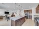 Spacious open-concept kitchen with granite countertops, stainless steel appliances and fixtures at 4641 Therapeutic St, North Las Vegas, NV 89031
