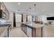 Beautiful kitchen features granite counters, stainless steel appliances and a large island with a sink at 4641 Therapeutic St, North Las Vegas, NV 89031
