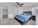 Spacious main bedroom featuring carpet, ceiling fan, and natural light at 4641 Therapeutic St, North Las Vegas, NV 89031