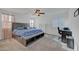 Large main bedroom includes a ceiling fan, carpet, and natural light at 4641 Therapeutic St, North Las Vegas, NV 89031