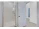 A walk-in shower with glass door and a bright clean look at 4641 Therapeutic St, North Las Vegas, NV 89031