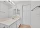 Bright bathroom with storage cabinet, modern fixtures, and tile flooring at 4708 Cohiba Way, North Las Vegas, NV 89031