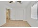 Bedroom with light floors, ceiling fan, double closet, and window with blinds at 4708 Cohiba Way, North Las Vegas, NV 89031