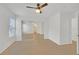 Open bedroom with wood floors, a closet with mirrored doors, and a ceiling fan at 4708 Cohiba Way, North Las Vegas, NV 89031