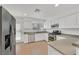 Modern kitchen with stainless steel appliances, white cabinets, and granite countertops at 4708 Cohiba Way, North Las Vegas, NV 89031