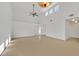 Spacious living room with light wood floors, a ceiling fan, and lots of natural light at 4708 Cohiba Way, North Las Vegas, NV 89031