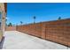 A fully walled backyard with a concrete patio, perfect for outdoor entertainment and privacy at 5282 Monterey Park Cir, Las Vegas, NV 89146