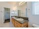 Bathroom featuring a granite countertop, double sinks, and tiled floor at 5282 Monterey Park Cir, Las Vegas, NV 89146