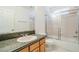 Bathroom featuring a granite countertop, vanity, and tiled shower at 5282 Monterey Park Cir, Las Vegas, NV 89146