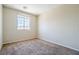 Bright carpeted bedroom with a large window, great natural light at 5282 Monterey Park Cir, Las Vegas, NV 89146