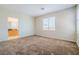 Bedroom with neutral carpet and ensuite access at 5282 Monterey Park Cir, Las Vegas, NV 89146