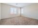 Bedroom with neutral carpet and multiple windows, providing natural light at 5282 Monterey Park Cir, Las Vegas, NV 89146
