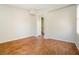 A bright, airy bedroom featuring wood-look floors and neutral walls at 5282 Monterey Park Cir, Las Vegas, NV 89146