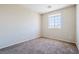 Bedroom with neutral carpet and window, providing natural light at 5282 Monterey Park Cir, Las Vegas, NV 89146
