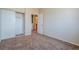 Bedroom with neutral carpet, slider closet doors, and ensuite access at 5282 Monterey Park Cir, Las Vegas, NV 89146