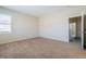 Bedroom with neutral carpet and ensuite access at 5282 Monterey Park Cir, Las Vegas, NV 89146