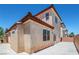Exterior view of a two-story home with a red tile roof, showing the patio and landscaped yard at 5282 Monterey Park Cir, Las Vegas, NV 89146
