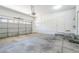 Spacious two-car garage featuring a white door and ample room for parking and storage at 5282 Monterey Park Cir, Las Vegas, NV 89146