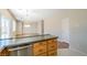 Kitchen featuring granite countertops, stainless steel dishwasher, and wood cabinetry at 5282 Monterey Park Cir, Las Vegas, NV 89146