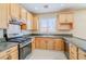 Beautiful kitchen with stainless steel appliances, granite countertops, and tile flooring at 5282 Monterey Park Cir, Las Vegas, NV 89146