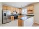 Modern kitchen featuring stainless steel appliances and a breakfast bar at 5282 Monterey Park Cir, Las Vegas, NV 89146