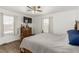 Comfortable bedroom with wood flooring, ceiling fan, and natural light at 531 New Mexico St, Boulder City, NV 89005
