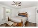 Bedroom featuring a bed and wood flooring with natural light from the windows at 531 New Mexico St, Boulder City, NV 89005