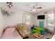 Cozy bedroom with a crib, twin bed, and play area at 531 New Mexico St, Boulder City, NV 89005