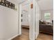 Bedroom featuring neutral walls and wood flooring with a glimpse of a living space at 531 New Mexico St, Boulder City, NV 89005