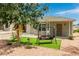 Cozy single-story home featuring a charming yard, swing, and inviting front porch entrance at 531 New Mexico St, Boulder City, NV 89005