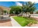 Charming single-story home highlighting a manicured lawn, swing, and a cozy front porch at 531 New Mexico St, Boulder City, NV 89005