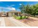 Charming single-story home with manicured front yard, inviting porch, and ample parking at 531 New Mexico St, Boulder City, NV 89005