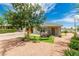 Inviting single-story home showcasing a well-maintained yard, swing, and quaint front entrance at 531 New Mexico St, Boulder City, NV 89005