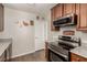 Modern kitchen featuring stainless steel appliances and wood cabinets at 531 New Mexico St, Boulder City, NV 89005