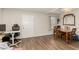 Spacious living room with wood flooring, natural light, and adjacent dining area at 531 New Mexico St, Boulder City, NV 89005