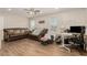 Spacious living room with wood floors, bright natural light, and a functional workspace at 531 New Mexico St, Boulder City, NV 89005