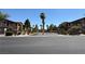 Apartments exterior showing well maintained landscaping and updated facade at 5751 E Hacienda Ave # 226, Las Vegas, NV 89122