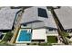Aerial view of home with pool, solar panels, manicured landscaping, and covered patio at 5927 Villa Loma St, Las Vegas, NV 89148