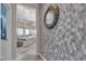 The bathroom features a tiled accent wall and floors, a soaking tub, and a seamless glass shower at 5927 Villa Loma St, Las Vegas, NV 89148