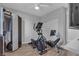 Bedroom featuring exercise equipment and a closet with mirrored doors on a modern floor at 5927 Villa Loma St, Las Vegas, NV 89148
