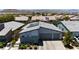 A modern home with a three-car garage and desert landscaping at 5927 Villa Loma St, Las Vegas, NV 89148