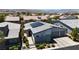 A modern home with a three-car garage, desert landscaping, and mountain views at 5927 Villa Loma St, Las Vegas, NV 89148