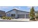 Charming house with an attached two-car garage and inviting curb appeal at 5927 Villa Loma St, Las Vegas, NV 89148