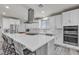 Modern kitchen featuring a large center island, stainless steel appliances, and sleek design at 5927 Villa Loma St, Las Vegas, NV 89148